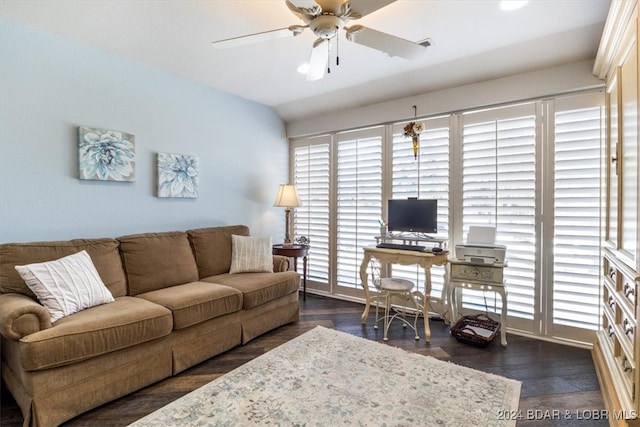 living room featuring ceiling fan, lofted ceiling, and dark wood-type flooring