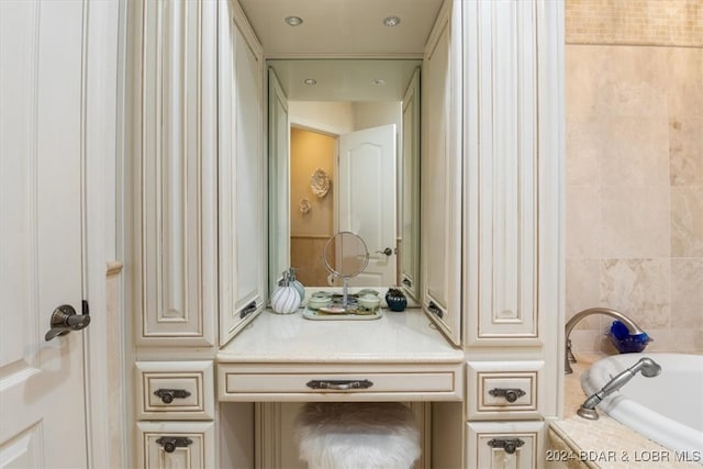 bathroom featuring tiled bath