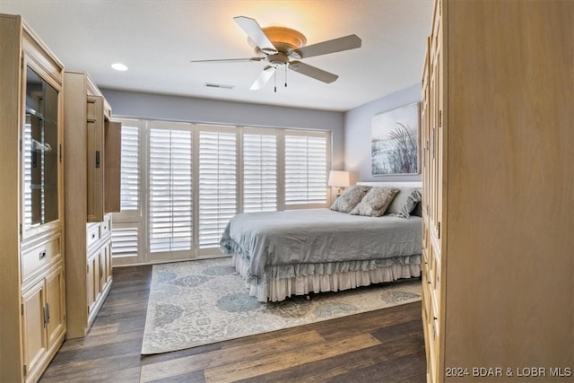 bedroom featuring ceiling fan and dark hardwood / wood-style flooring