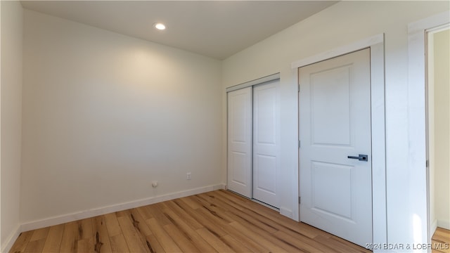 unfurnished bedroom featuring light hardwood / wood-style flooring