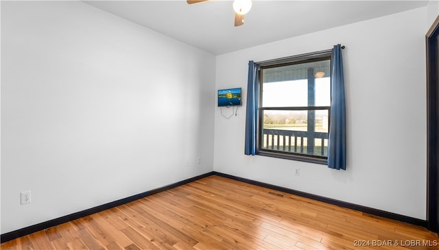 unfurnished room with ceiling fan and light wood-type flooring