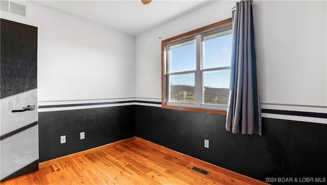 empty room with light hardwood / wood-style floors