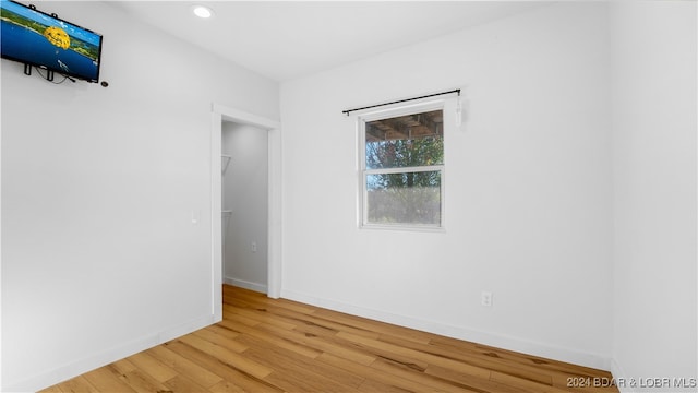 spare room with light wood-type flooring