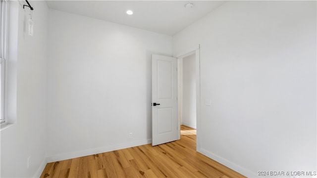 unfurnished room featuring light hardwood / wood-style floors