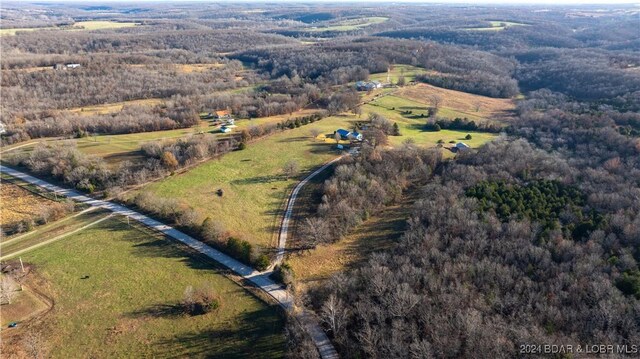 birds eye view of property featuring a rural view