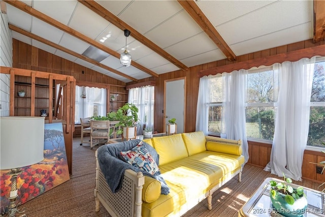 sunroom with vaulted ceiling with beams and plenty of natural light