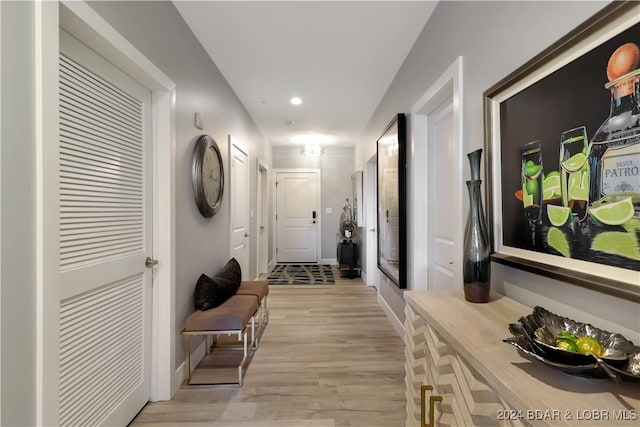 hall with light hardwood / wood-style flooring