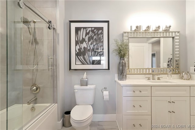 full bathroom with vanity, toilet, and enclosed tub / shower combo