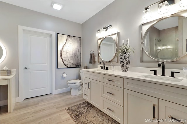 bathroom featuring hardwood / wood-style floors, vanity, and toilet