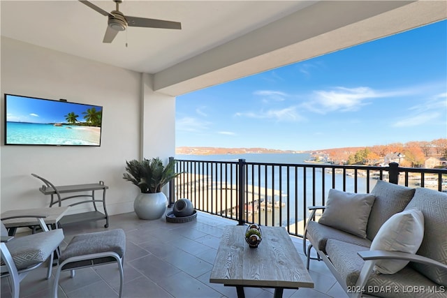 balcony featuring an outdoor hangout area and a water view