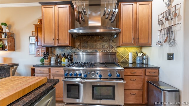 kitchen with ornamental molding, double oven range, decorative backsplash, and exhaust hood