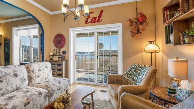 interior space with a water view, ornamental molding, light tile patterned flooring, and plenty of natural light