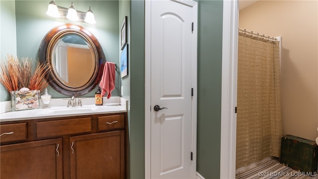 bathroom with vanity and walk in shower