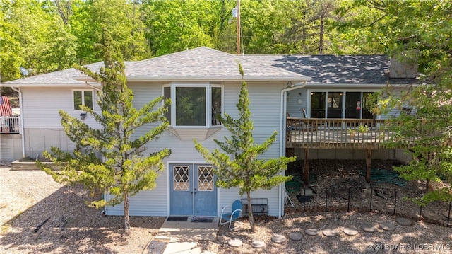 back of property featuring a deck