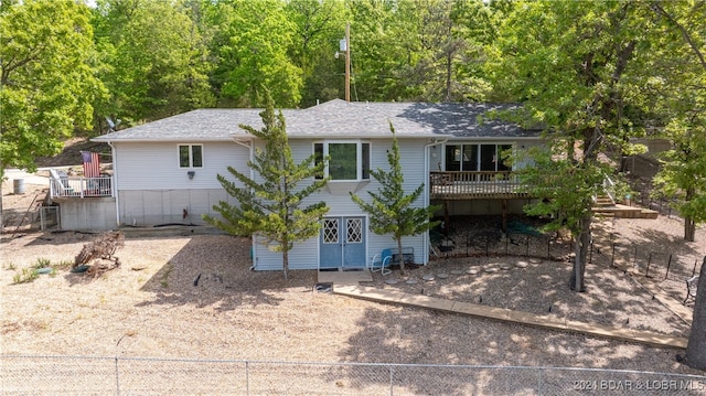 view of front of property with a wooden deck