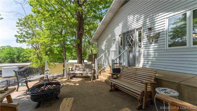 view of patio / terrace featuring an outdoor fire pit