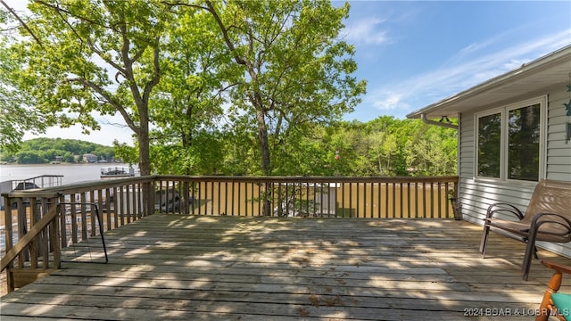 deck featuring a water view