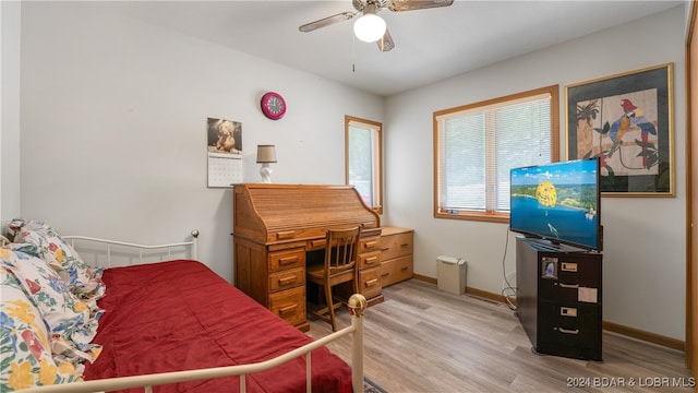 bedroom featuring hardwood / wood-style flooring and ceiling fan