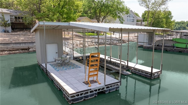 dock area with a water view