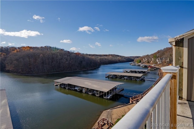 611 Lazy Days Rd Unit C9, Osage Beach, MO 65065 - dock area featuring a water view and a wooded view