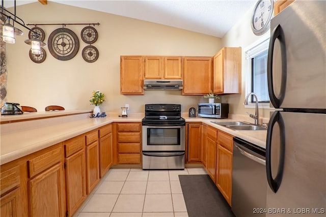 611 Lazy Days Rd Unit C9, Osage Beach, MO 65065 - kitchen with stainless steel appliances, under cabinet range hood, vaulted ceiling, a sink, and light tile patterned floors