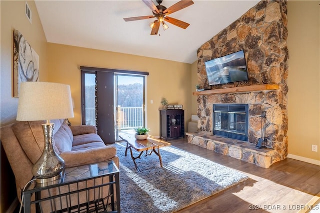 living room featuring a fireplace, dark wood-type flooring, ceiling fan, and lofted ceiling