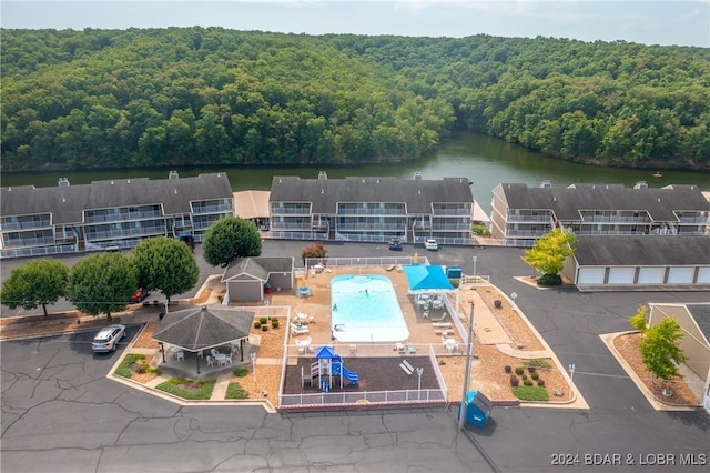 611 Lazy Days Rd Unit C9, Osage Beach, MO 65065 - bird's eye view of a heavily wooded area, a pool, and a nearby body of water