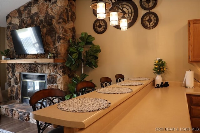 611 Lazy Days Rd Unit C9, Osage Beach, MO 65065 - dining room featuring wood finished floors and a fireplace