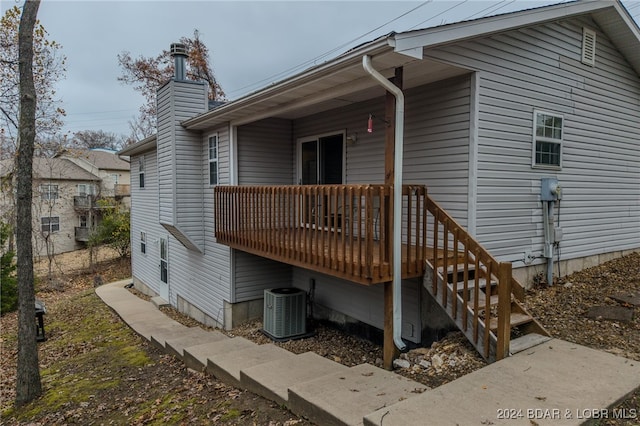 rear view of property with central air condition unit