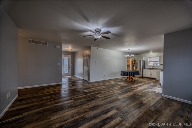 unfurnished living room featuring sink, ceiling fan with notable chandelier, dark hardwood / wood-style floors, and pool table