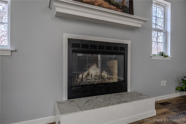 interior details featuring hardwood / wood-style flooring