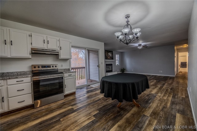 kitchen featuring white cabinets, dark hardwood / wood-style flooring, electric stove, and hanging light fixtures