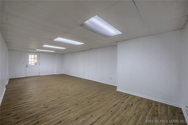 unfurnished room featuring a paneled ceiling and wood-type flooring