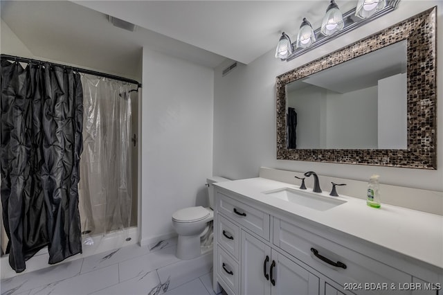 bathroom with vanity, toilet, and curtained shower