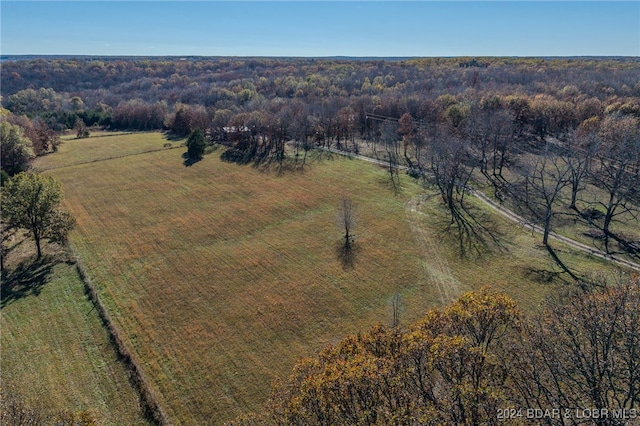 birds eye view of property with a rural view