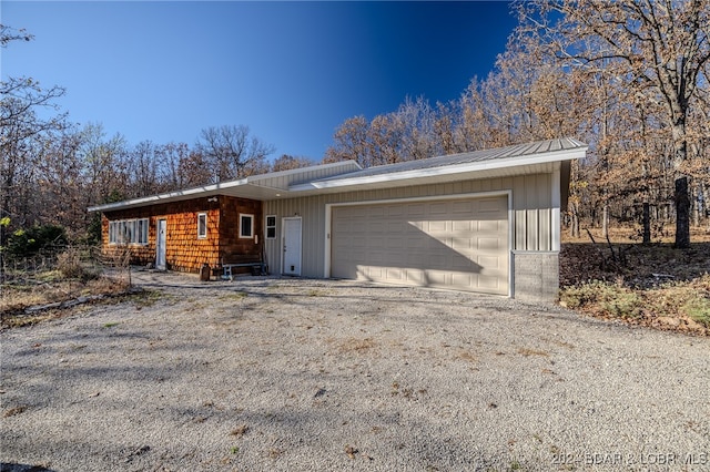 ranch-style home featuring a garage