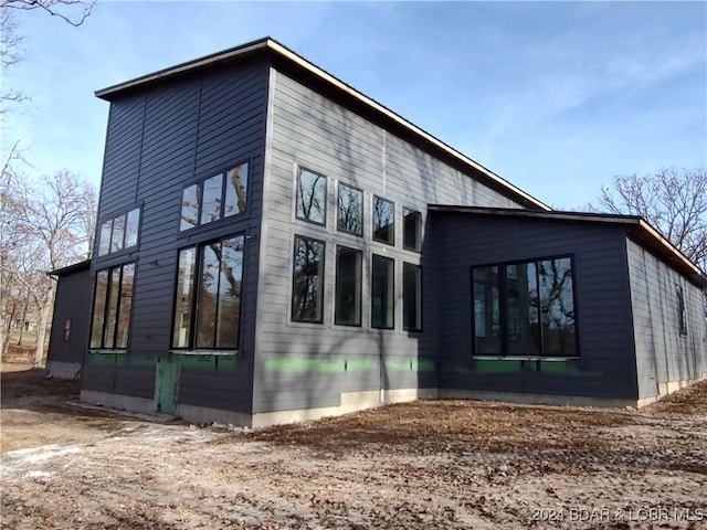 view of home's exterior featuring a sunroom