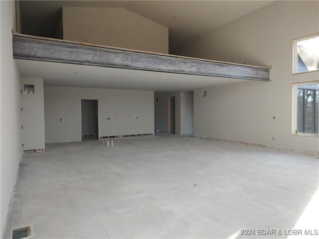 spare room featuring vaulted ceiling