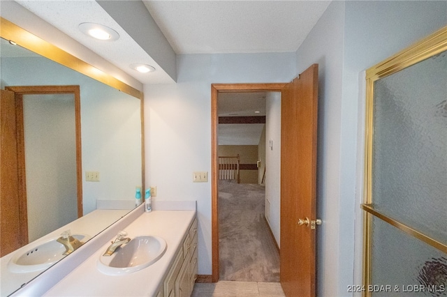 bathroom with tile patterned floors and vanity