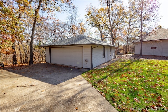 garage featuring a yard