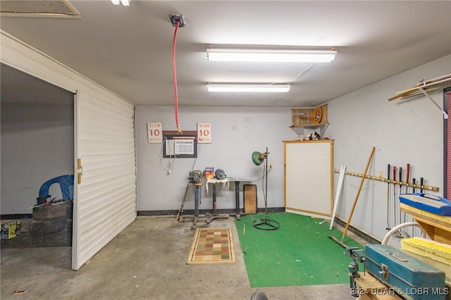 basement featuring an AC wall unit