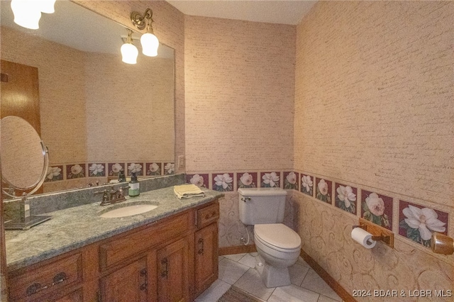 bathroom with tile patterned floors, vanity, and toilet