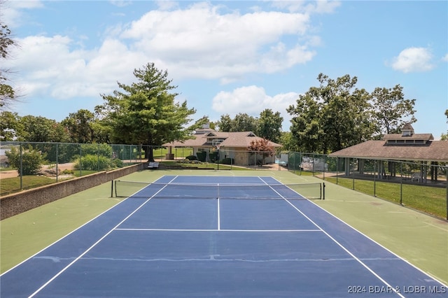 view of tennis court featuring basketball court