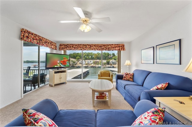 carpeted living room featuring ceiling fan