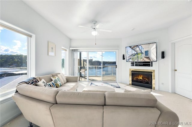 living room featuring ceiling fan and light colored carpet