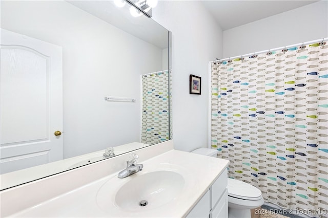 bathroom with vanity and toilet