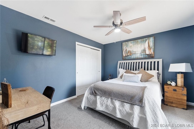 bedroom featuring carpet floors, ceiling fan, and a closet