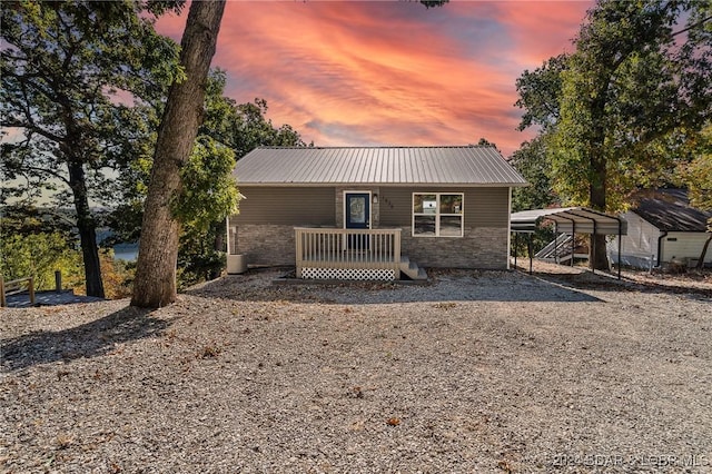 view of front of home with a carport