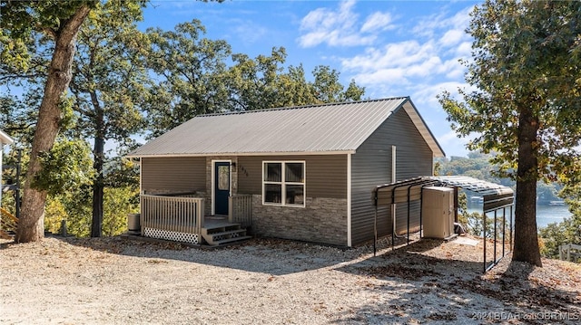 view of front of home with a carport