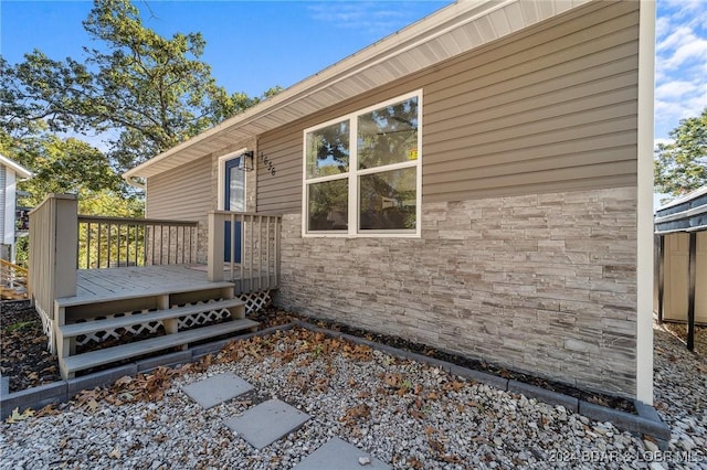 view of side of home with a deck